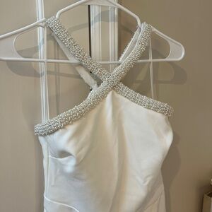 Likely white beaded jumpsuit